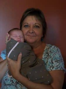 marion-canning_holding-grandson